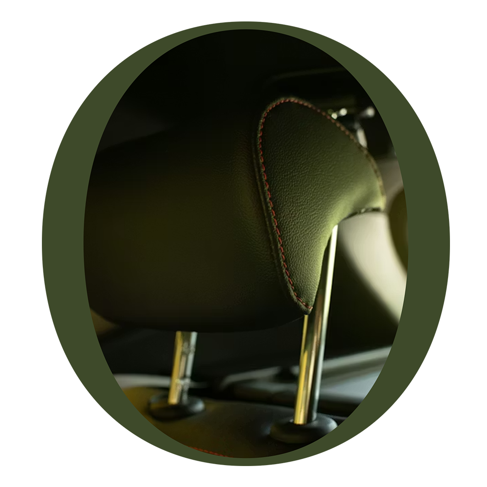 Close-up of brown leather automotive headrests with metal support posts